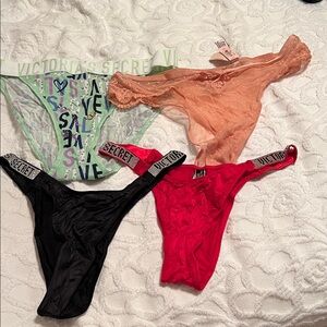 Victoria's Secret Panties Set - Black, Red, peach, and mint with VS graphics.